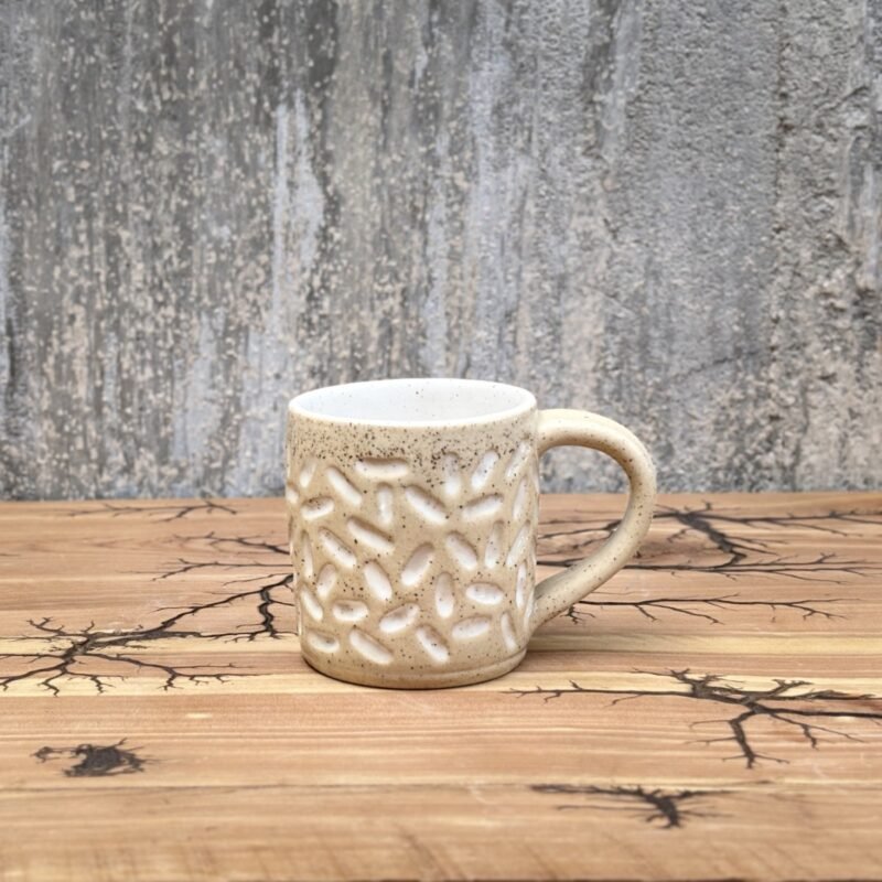 Handmade beige and white mug