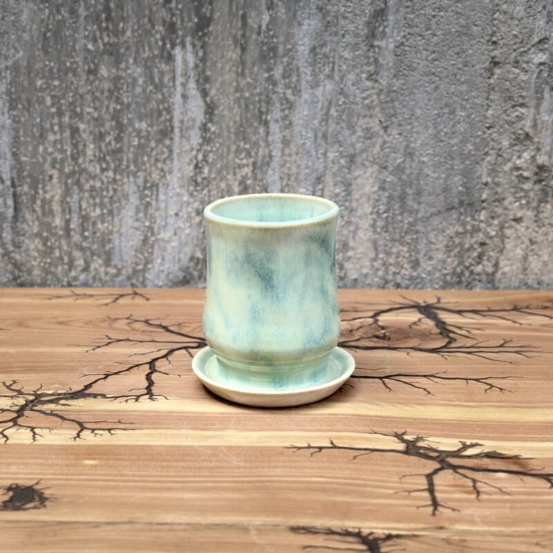 Handmade greenish glossed mug